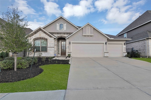 view of front of house with a garage and a front lawn