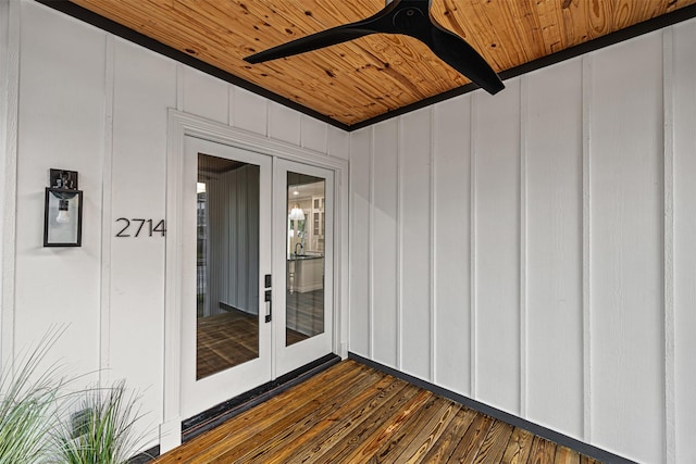 wooden deck featuring ceiling fan and french doors