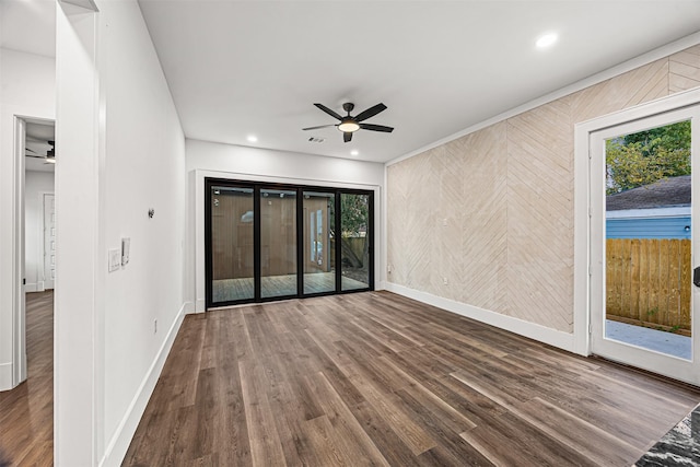 2714 Hardy St, Houston, TX 77009 - spare room with ceiling fan, wood finished floors, plenty of natural light, wooden walls, and recessed lighting