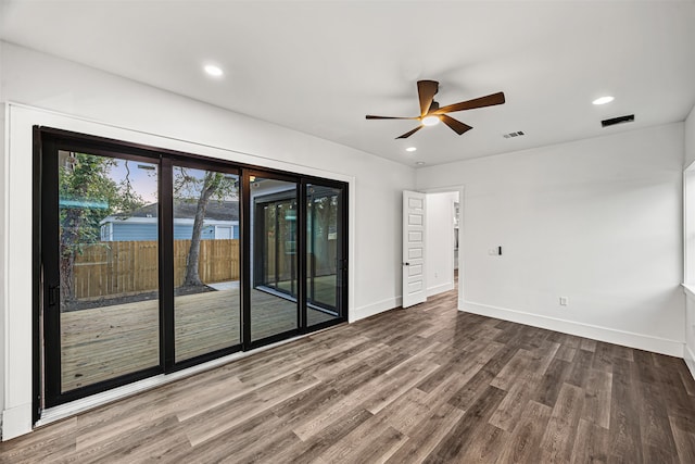 spare room featuring ceiling fan and hardwood / wood-style floors