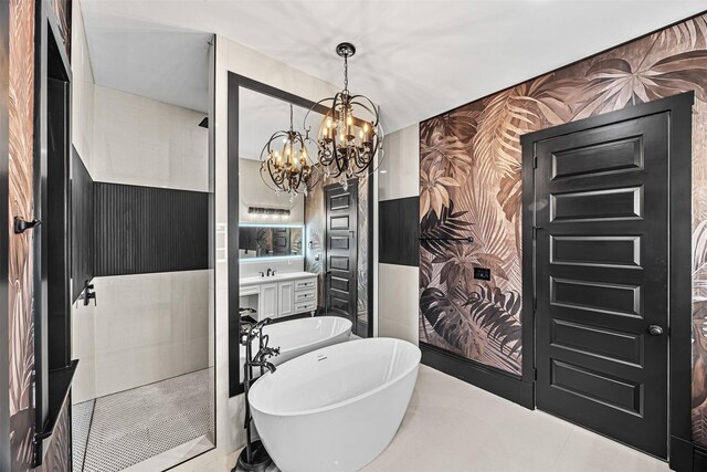 2714 Hardy St, Houston, TX 77009 - bathroom featuring a freestanding bath, a chandelier, vanity, and wallpapered walls