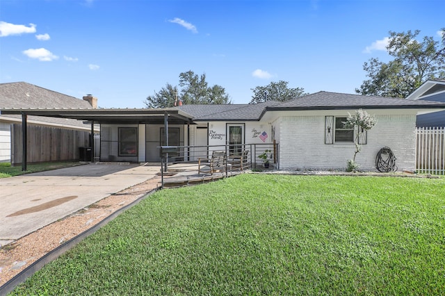 ranch-style home with a front lawn and a carport