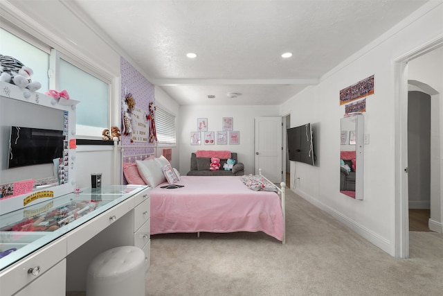 bedroom with light colored carpet and crown molding