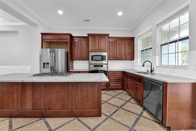 kitchen with stainless steel appliances, a center island, decorative backsplash, sink, and ornamental molding