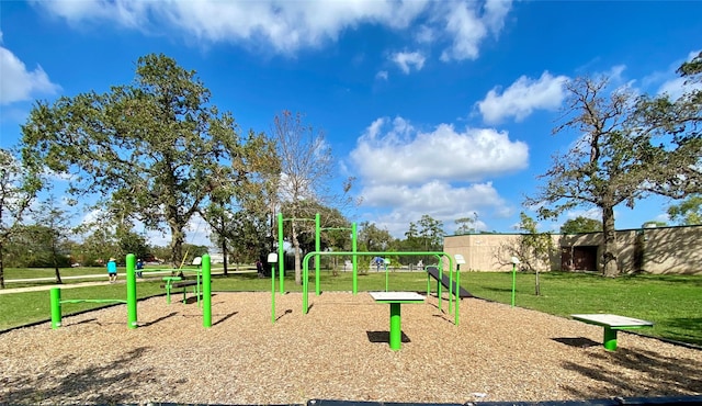 view of property's community featuring a lawn and a playground