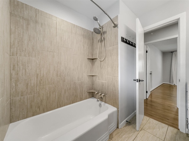 bathroom featuring tile patterned flooring and tiled shower / bath combo