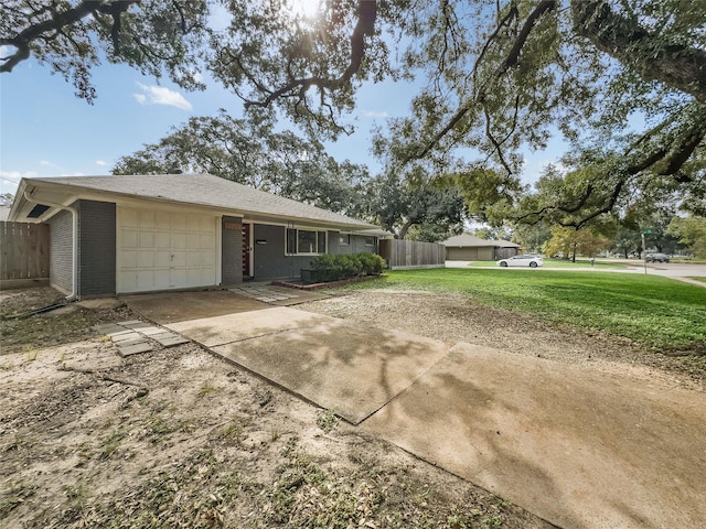 view of front of house featuring a garage and a front lawn