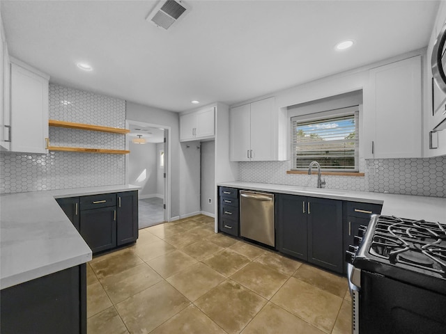 kitchen featuring white cabinets, sink, and stainless steel appliances