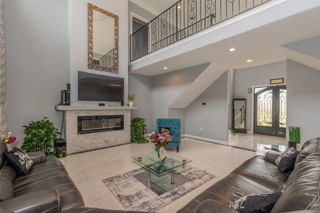 living room with a towering ceiling