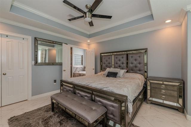 bedroom with ceiling fan, crown molding, and a tray ceiling