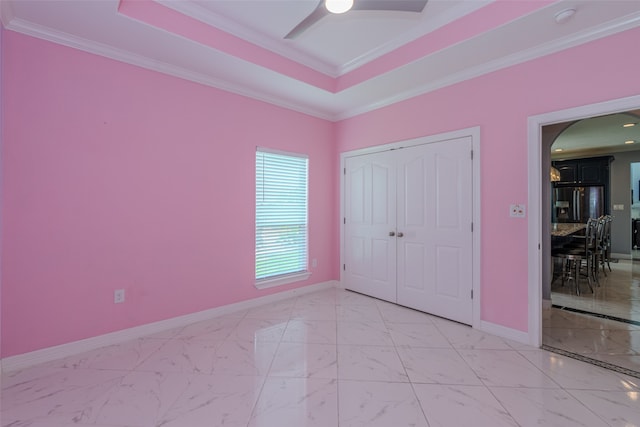 unfurnished bedroom featuring a closet, ceiling fan, and ornamental molding