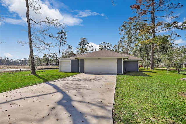 exterior space with a garage and a yard