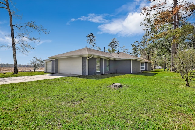 ranch-style home featuring a garage and a front lawn