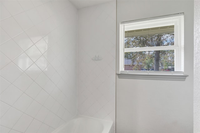 bathroom featuring a tub