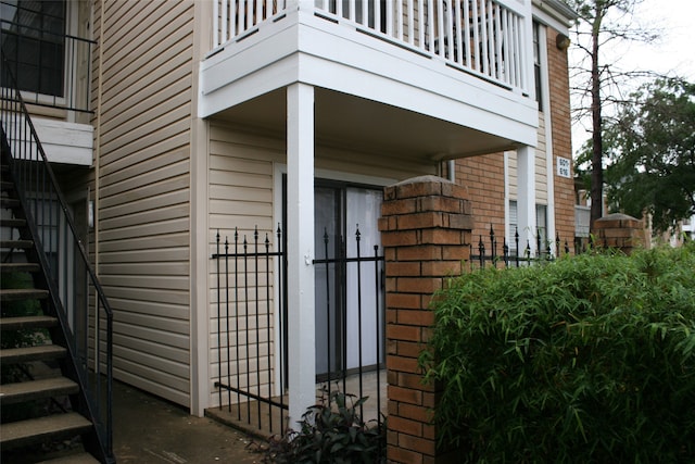 view of home's exterior with a balcony