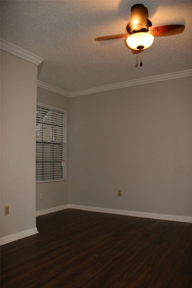 spare room with a textured ceiling, ornamental molding, dark hardwood / wood-style floors, and ceiling fan