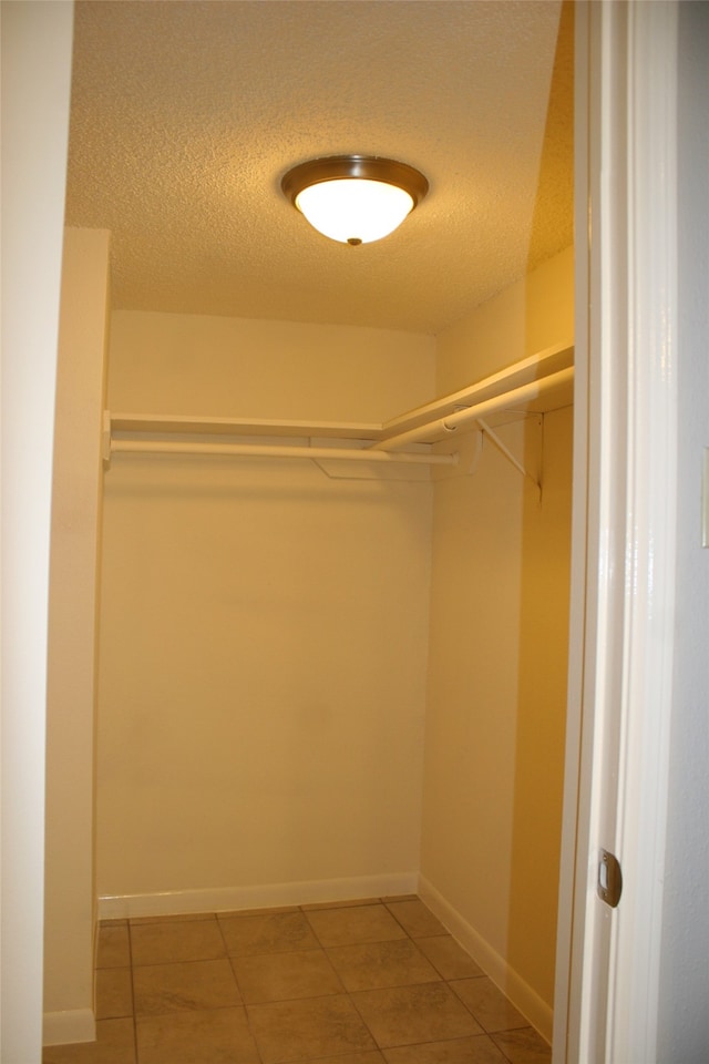 spacious closet featuring tile patterned floors