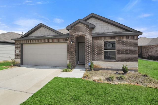 view of front of home featuring a front lawn and a garage