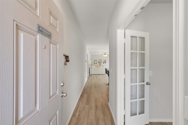 hall with light hardwood / wood-style flooring