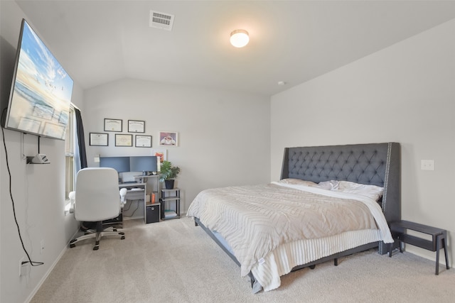 bedroom featuring lofted ceiling and carpet