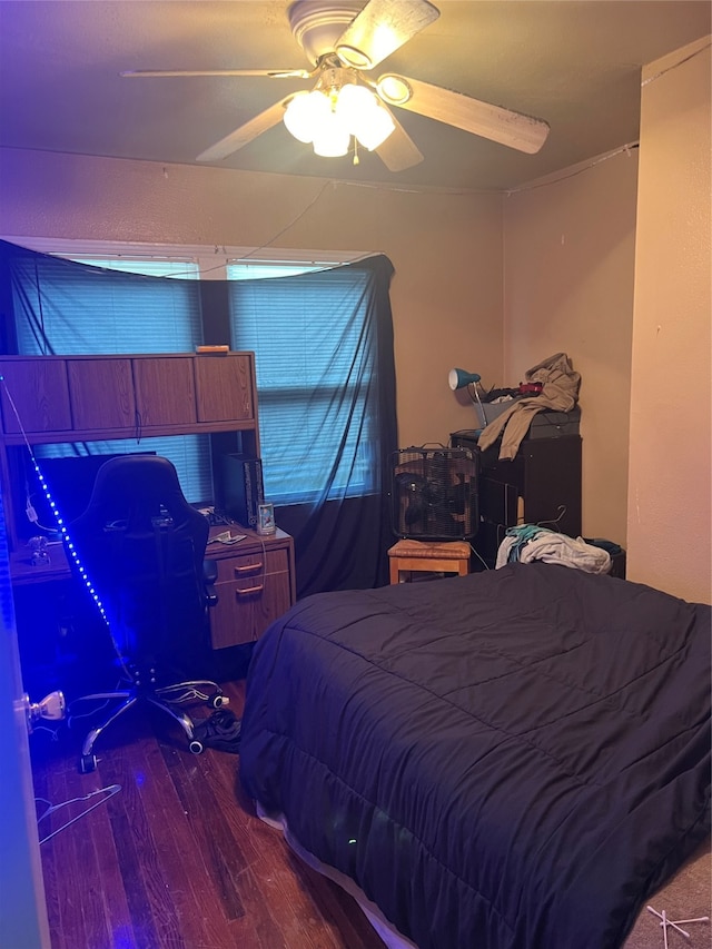 bedroom featuring hardwood / wood-style flooring and ceiling fan