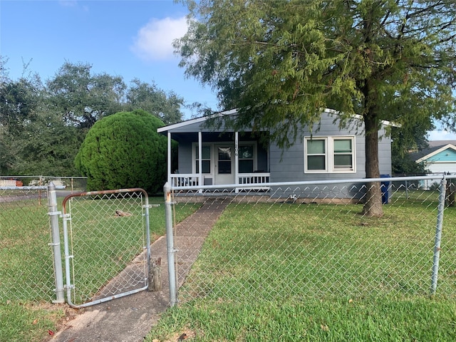 view of front of house with a front yard and a porch