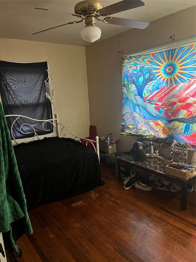 bedroom featuring hardwood / wood-style flooring and ceiling fan