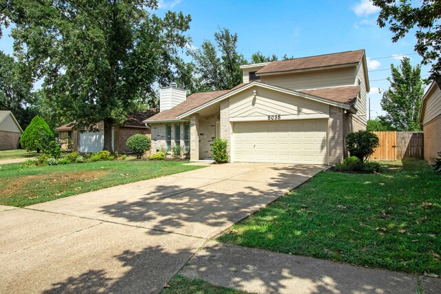 view of front facade with a garage and a front yard