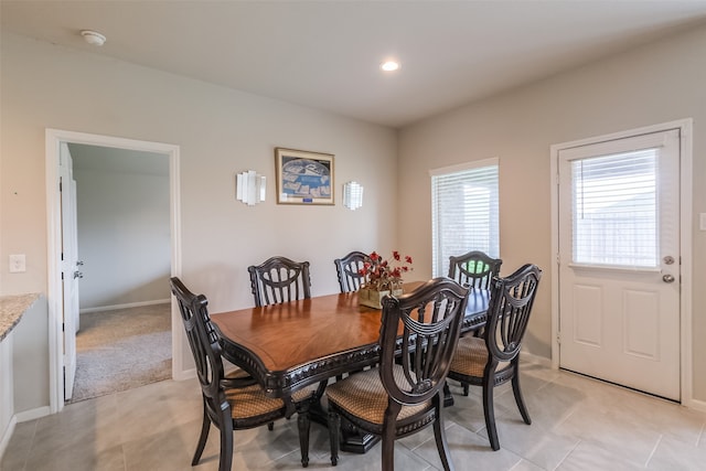 dining space with light tile patterned flooring