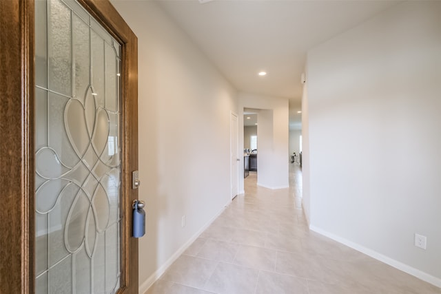 corridor with light tile patterned flooring