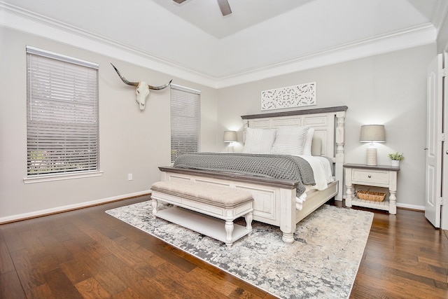 bedroom with dark hardwood / wood-style flooring, ceiling fan, and ornamental molding