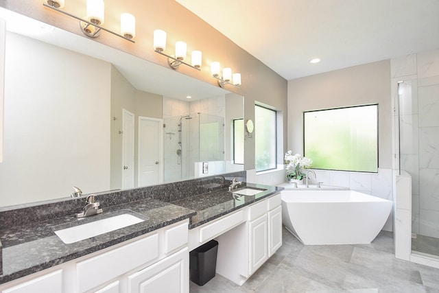 bathroom featuring vanity and separate shower and tub