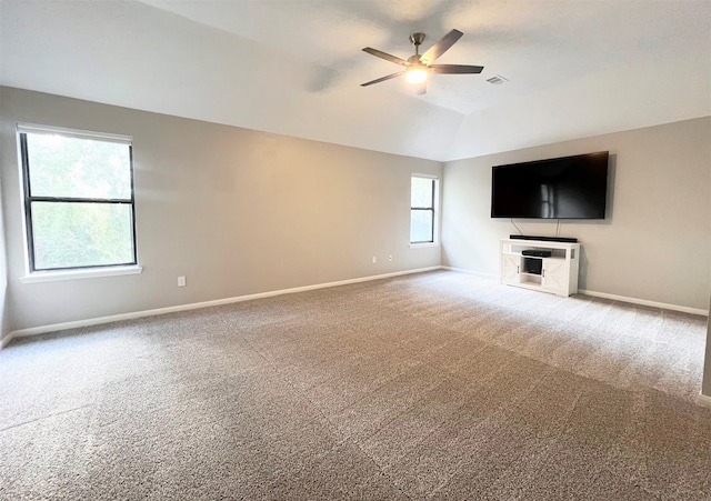 unfurnished living room with carpet, vaulted ceiling, and ceiling fan