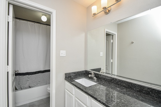 full bathroom featuring shower / bath combo, vanity, and toilet