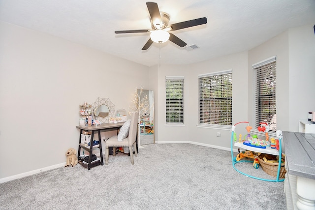 home office featuring carpet floors and ceiling fan