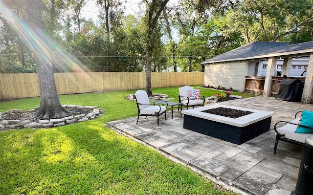 view of yard featuring a patio area and an outdoor living space with a fire pit