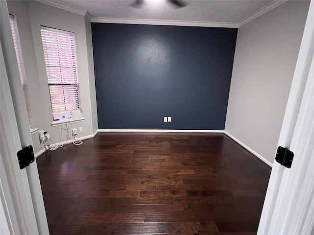 spare room featuring hardwood / wood-style floors and ornamental molding