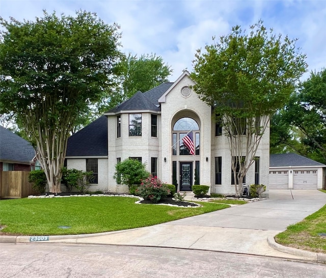 view of front facade with a front lawn and a garage