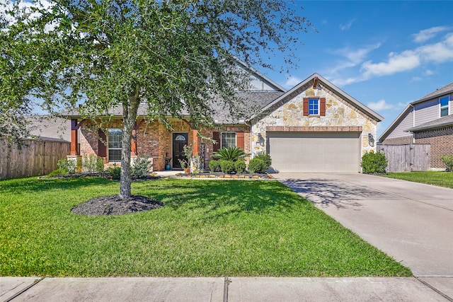 view of front of house featuring a garage and a front lawn