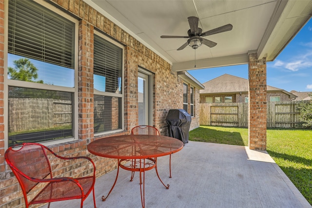 view of patio / terrace with ceiling fan and area for grilling