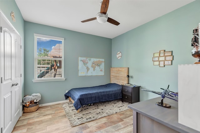 bedroom featuring ceiling fan and light hardwood / wood-style flooring