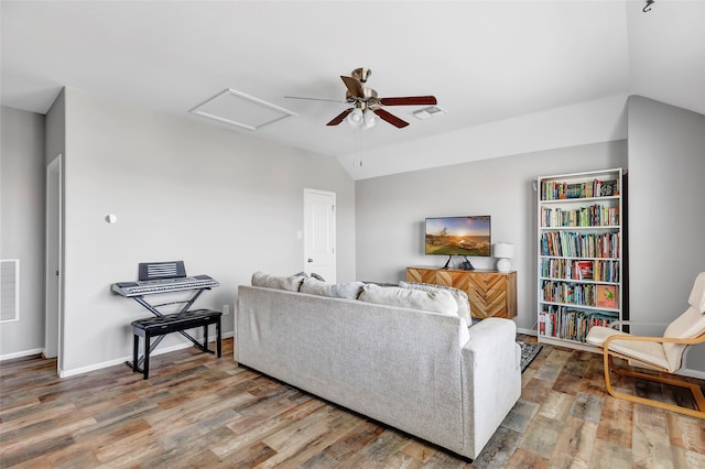 living room with lofted ceiling, hardwood / wood-style flooring, and ceiling fan