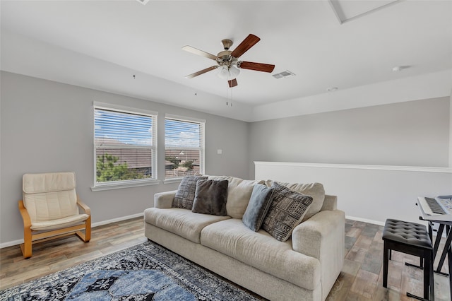 living room featuring hardwood / wood-style flooring and ceiling fan