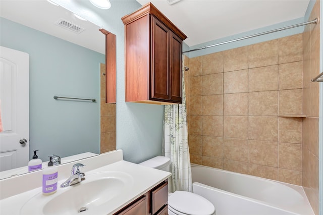 full bathroom with shower / tub combo with curtain, vanity, and toilet