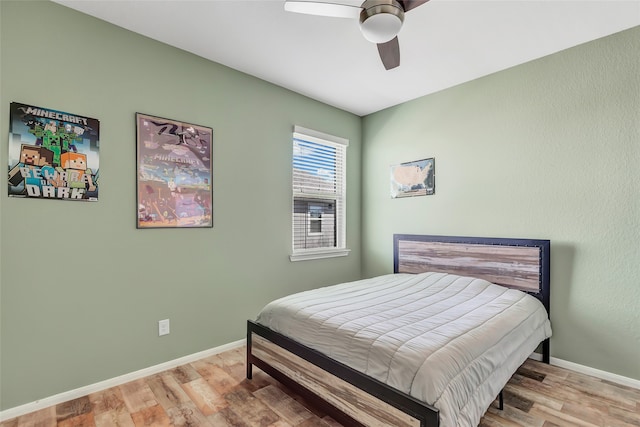 bedroom featuring light wood-type flooring and ceiling fan