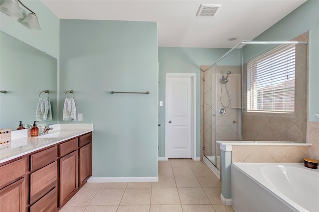 bathroom with tile patterned flooring, vanity, and independent shower and bath