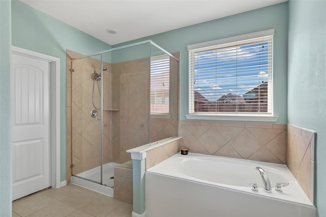 bathroom with tile patterned floors and separate shower and tub