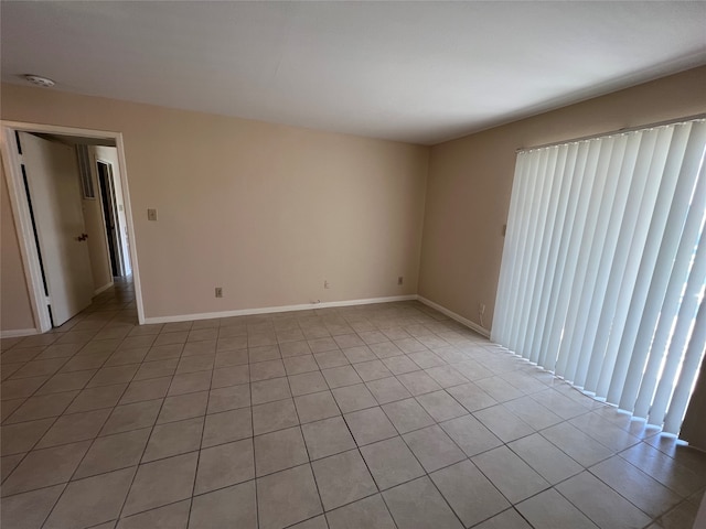 spare room with light tile patterned flooring