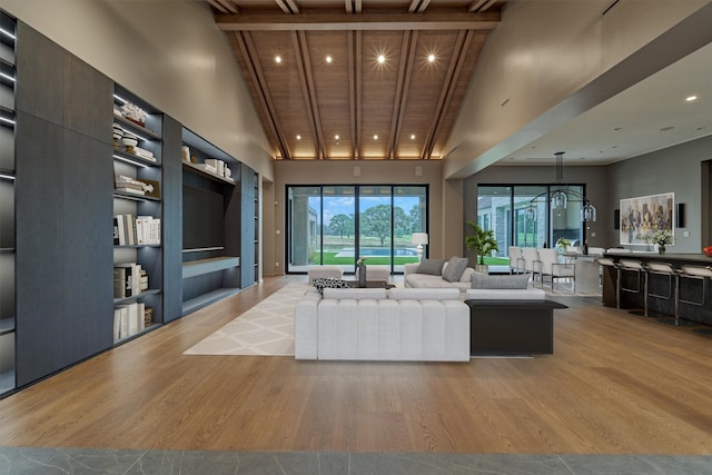 living room with high vaulted ceiling, light hardwood / wood-style floors, beam ceiling, and wood ceiling