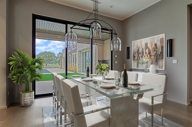 dining space featuring light wood-type flooring and ornamental molding